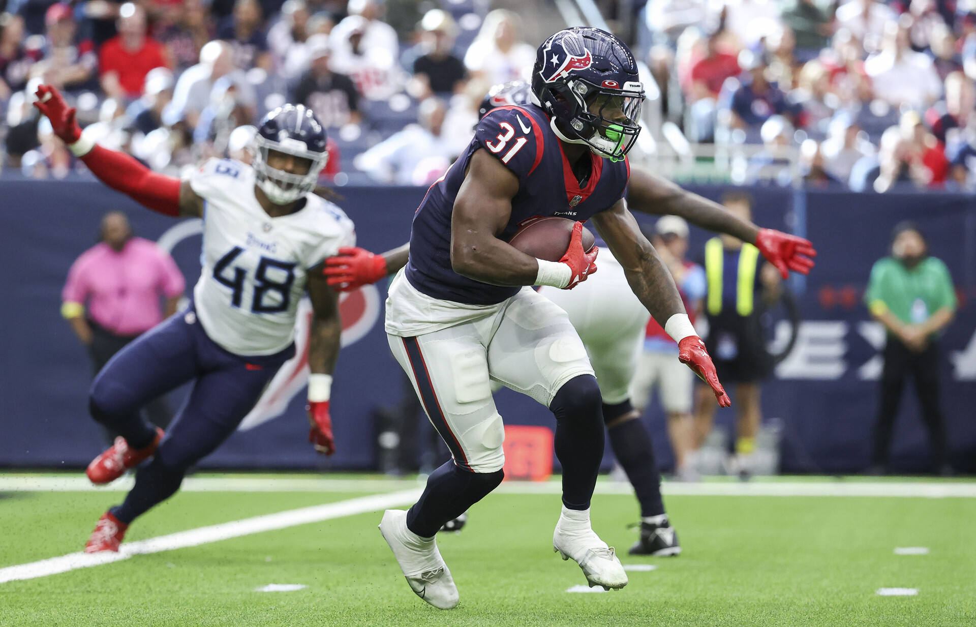 Oct 30, 2022; Houston, Texas, USA; Houston Texans running back Dameon Pierce (31) runs with the ball during the game against the Tennessee Titans at NRG Stadium.