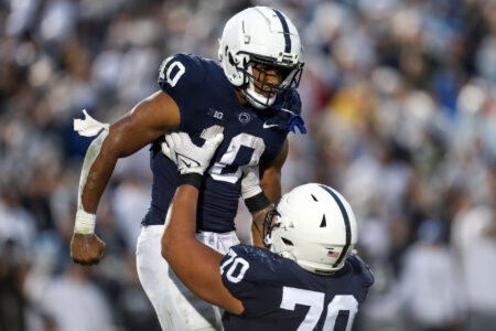 Penn State Nittany Lions running back Nicholas Singleton (10) celebrates with offensive linesman Juice Scruggs (70) after scoring a touchdown during the second quarter against the Maryland Terrapins at Beaver Stadium. Penn State defeated Maryland 30-0.