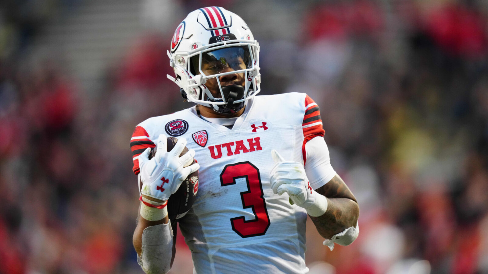 Utah Utes running back Ja'Quinden Jackson (3) carries the ball for a touchdown the third quarter against the Colorado Buffaloes at Folsom Field.
