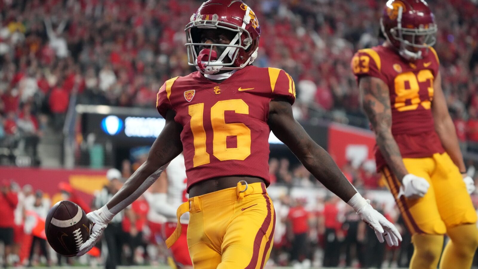 Southern California Trojans wide receiver Tahj Washington (16) celebrates after scoring on a 2-yard touchdown reception against the Utah Utes in the first half of the Pac-12 Championship at Allegiant Stadium.