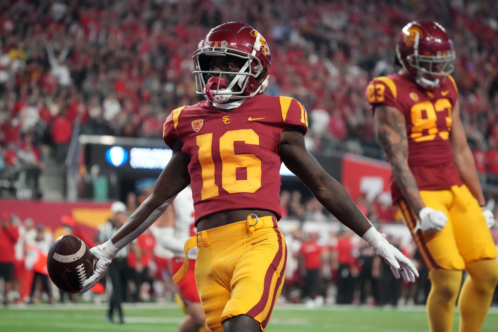 Southern California Trojans wide receiver Tahj Washington (16) celebrates after scoring on a 2-yard touchdown reception against the Utah Utes in the first half of the Pac-12 Championship at Allegiant Stadium.