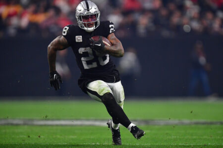 Jan 7, 2023; Paradise, Nevada, USA; Las Vegas Raiders running back Josh Jacobs (28) runs the ball against the Kansas City Chiefs during the second half at Allegiant Stadium.