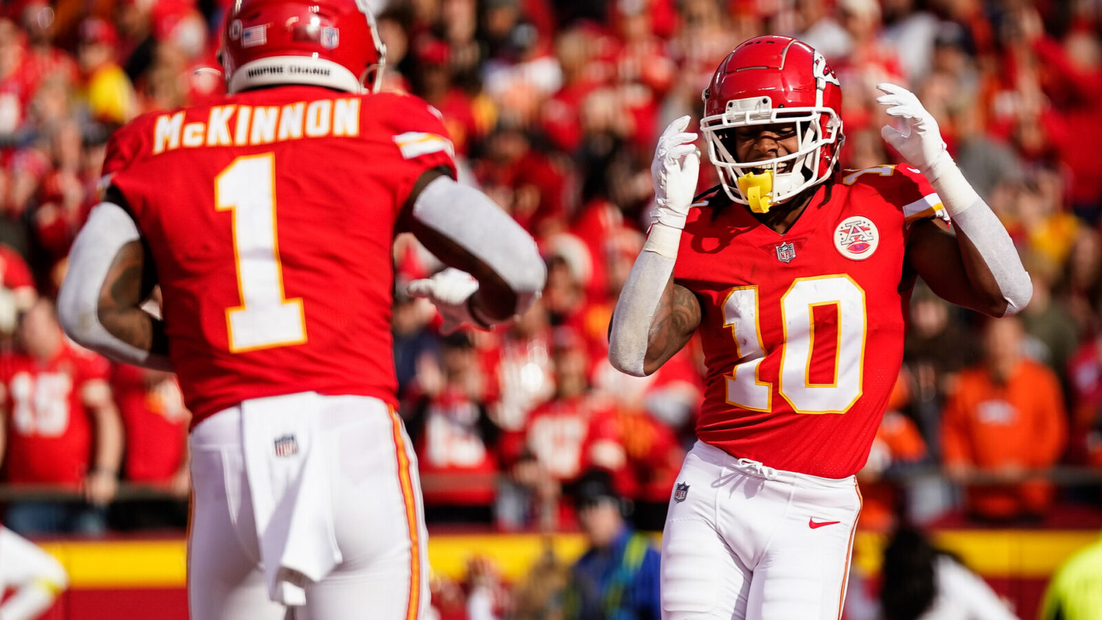 Kansas City Chiefs running back Isiah Pacheco (10) celebrates with running back Jerick McKinnon (1) after scoring a touchdown during the first half against the Denver Broncos at GEHA Field at Arrowhead Stadium.