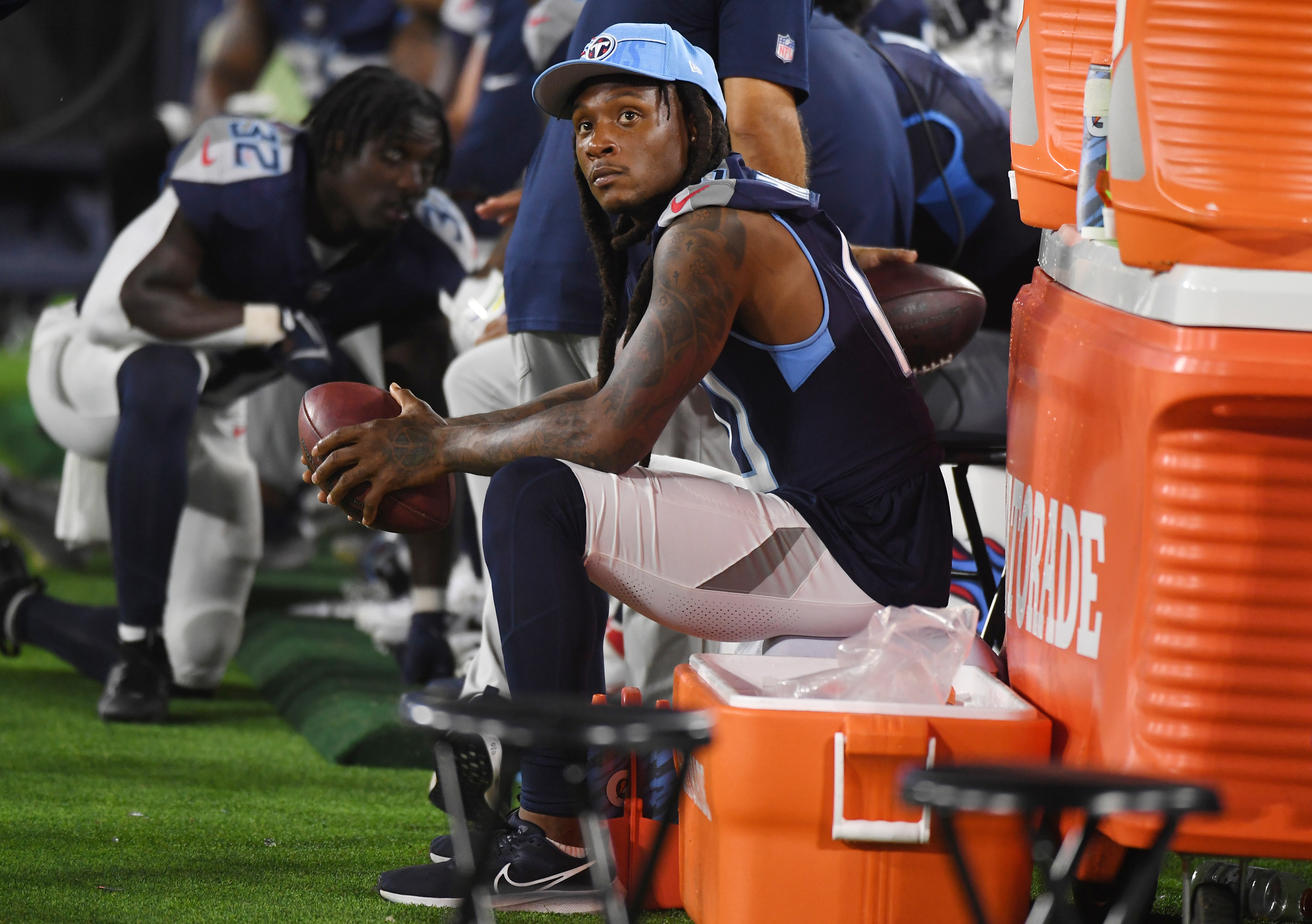 Aug 25, 2023; Nashville, Tennessee, USA; Tennessee Titans wide receiver DeAndre Hopkins (10) watches the game from the sidelines during the second half against the New England Patriots at Nissan Stadium.