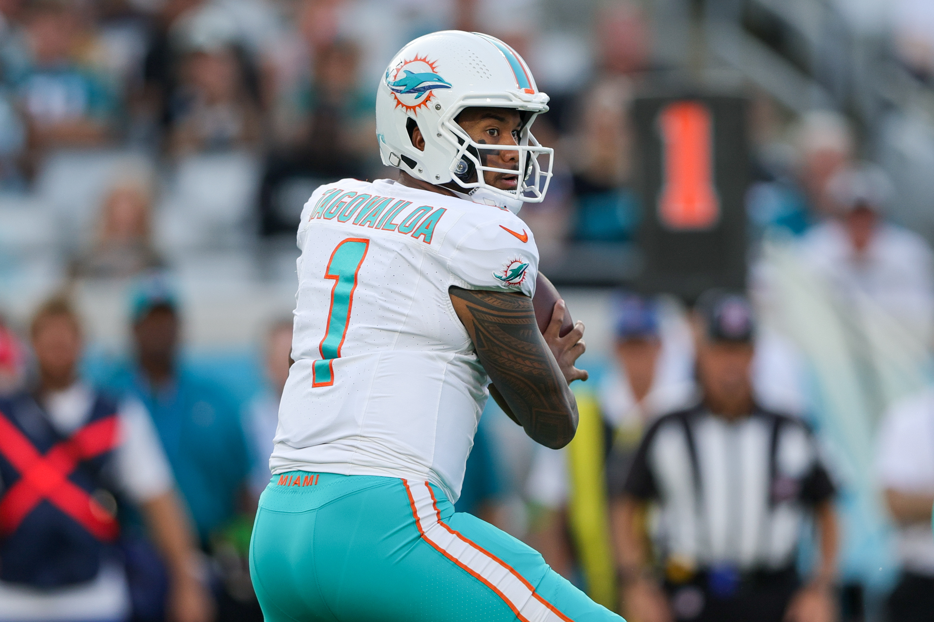 Aug 26, 2023; Jacksonville, Florida, USA; Miami Dolphins quarterback Tua Tagovailoa (1) drops back to pass against the Jacksonville Jaguars in the first quarter at EverBank Stadium.
