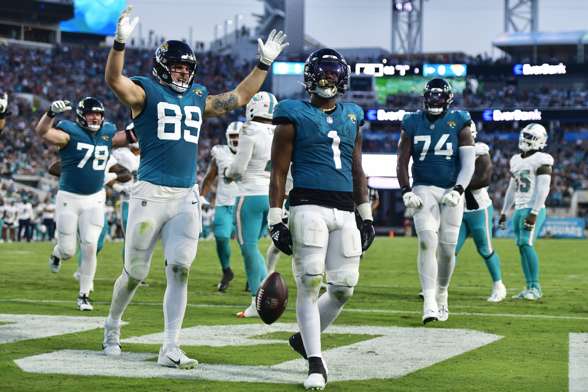Jacksonville Jaguars running back Travis Etienne Jr. (1) scores a touchdown during the second quarter of a preseason matchup Saturday, Aug. 26, 2023 at EverBank Stadium in Jacksonville, Fla.