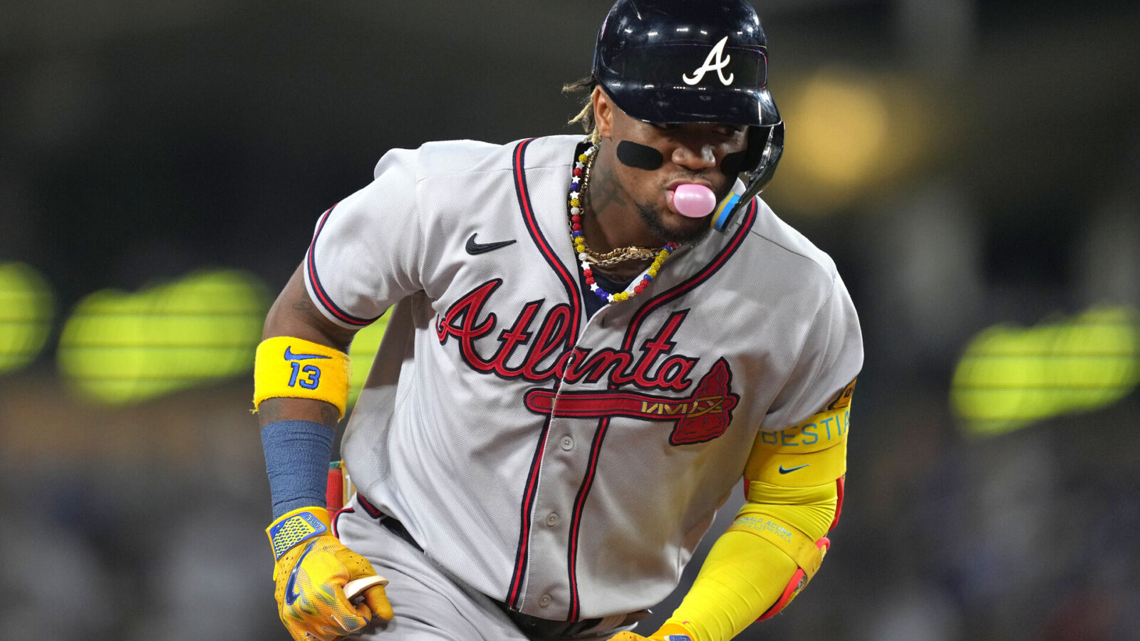 Aug 31, 2023; Los Angeles, California, USA; Atlanta Braves right fielder Ronald Acuna Jr. (13) runs the bases after hitting a grand slam home run in the second inning against the Los Angeles Dodger at Dodger Stadium.