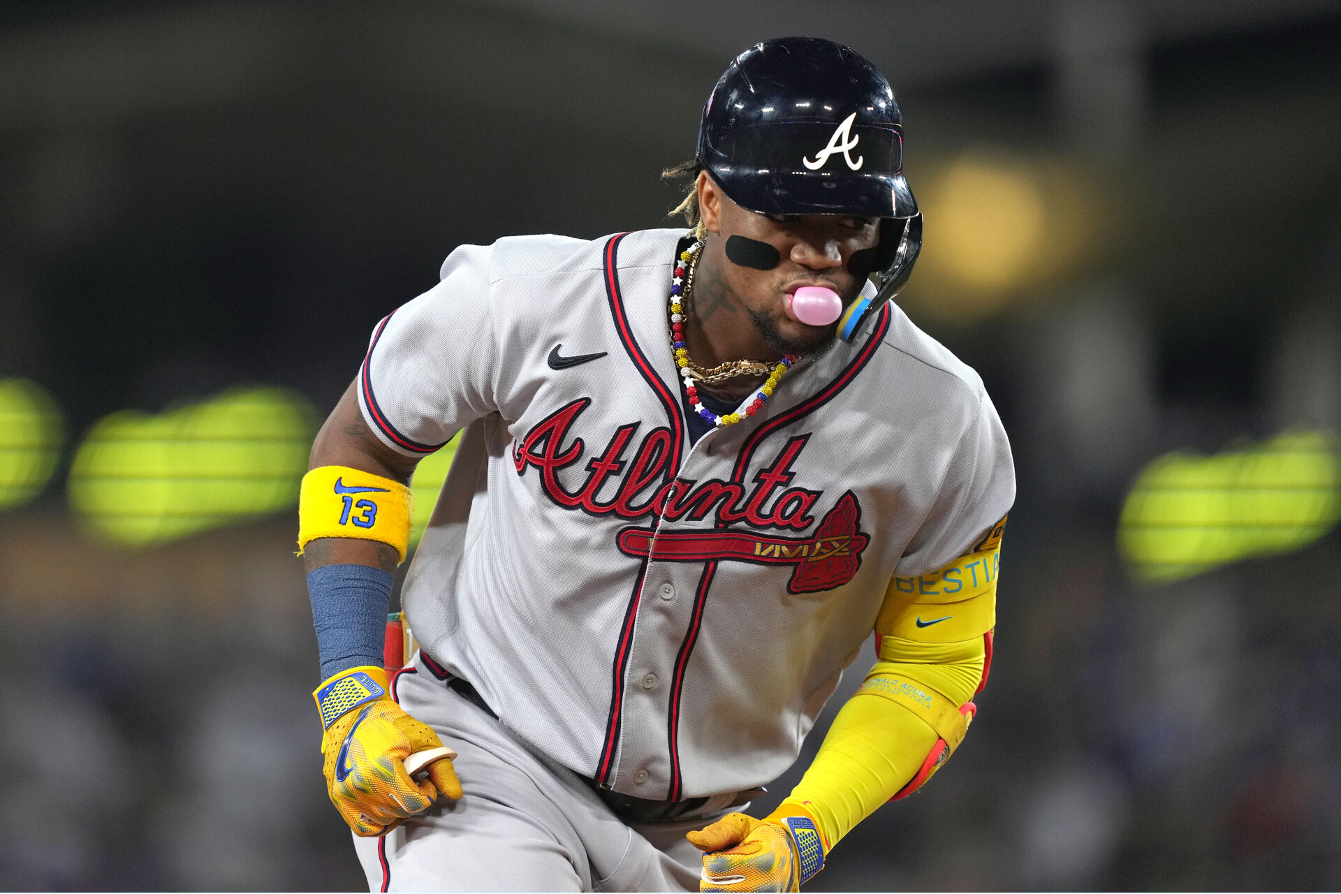Aug 31, 2023; Los Angeles, California, USA; Atlanta Braves right fielder Ronald Acuna Jr. (13) runs the bases after hitting a grand slam home run in the second inning against the Los Angeles Dodger at Dodger Stadium.