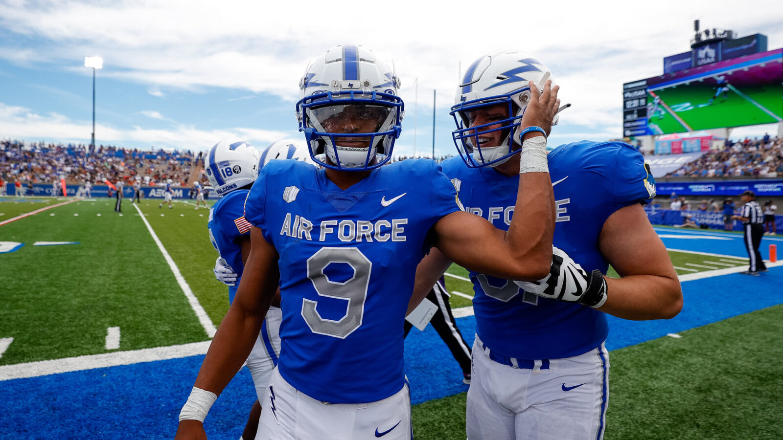Zac Larrier (9) celebrates with offensive tackle Kaleb Holcomb (51) after a touchdown in the second quarter against the Robert Morris Colonials at Falcon Stadium.