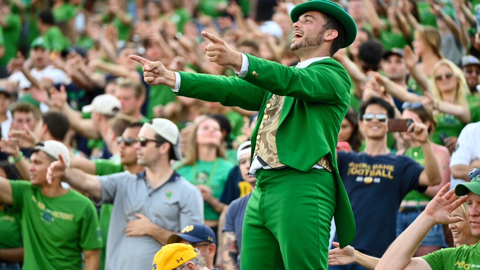 The Notre Dame Fighting Irish leprechaun mascot leads the student section in cheering in the fourth quarter against the Tennessee State Tigers at Notre Dame Stadium.