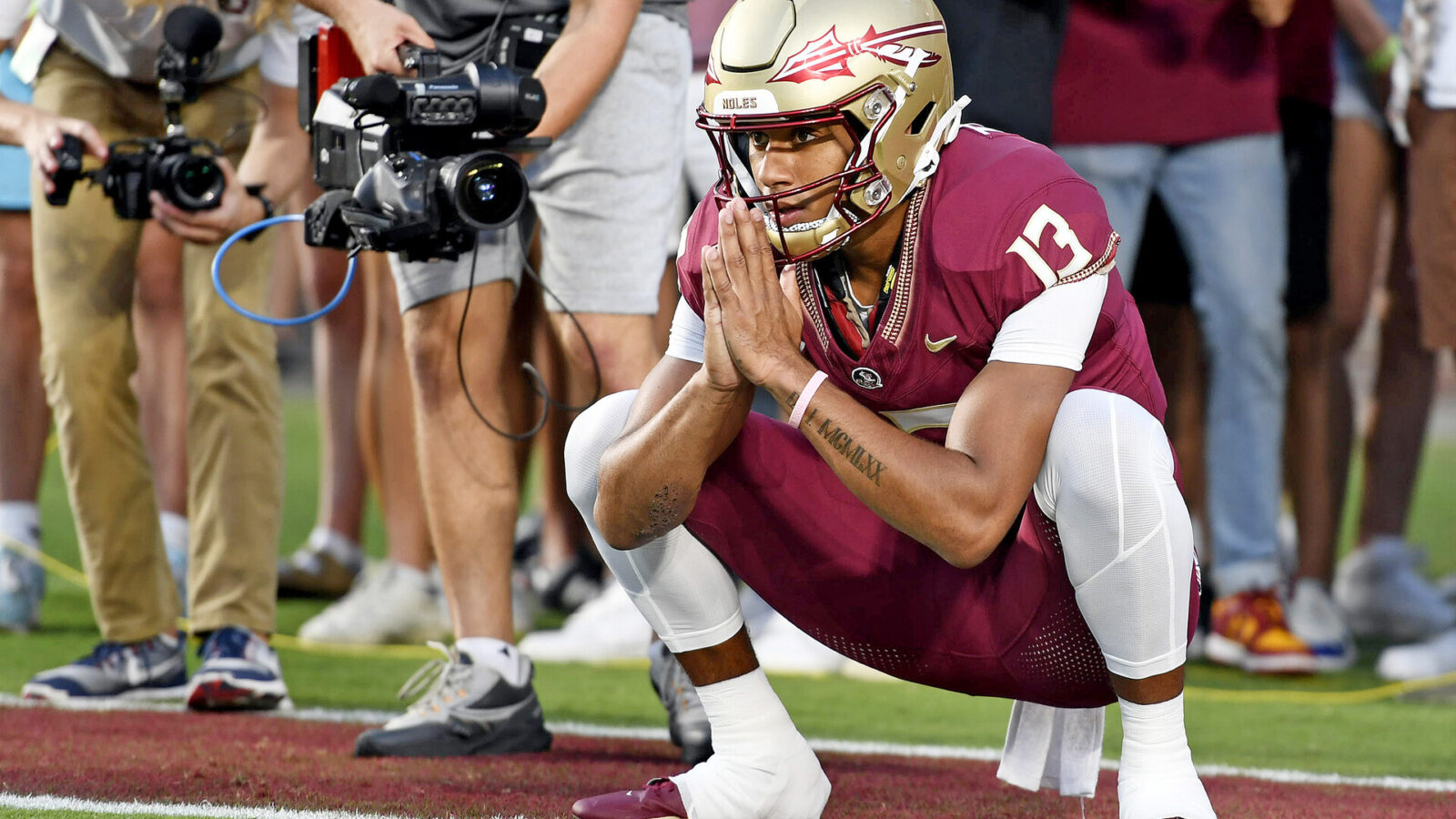 Sep 9, 2023; Tallahassee, Florida, USA; Florida State Seminoles quarterback Jordan Travis (13) warms up before the game against the Southern Miss Golden Eagles at Doak S. Campbell Stadium.
