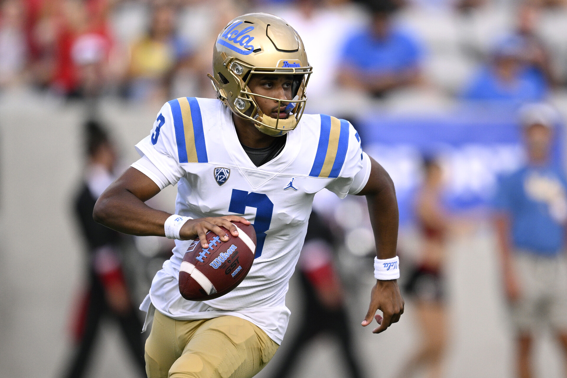 Sep 9, 2023; San Diego, California, USA; UCLA Bruins quarterback Dante Moore (3) runs with the ball against the San Diego State Aztecs during the first half at Snapdragon Stadium.