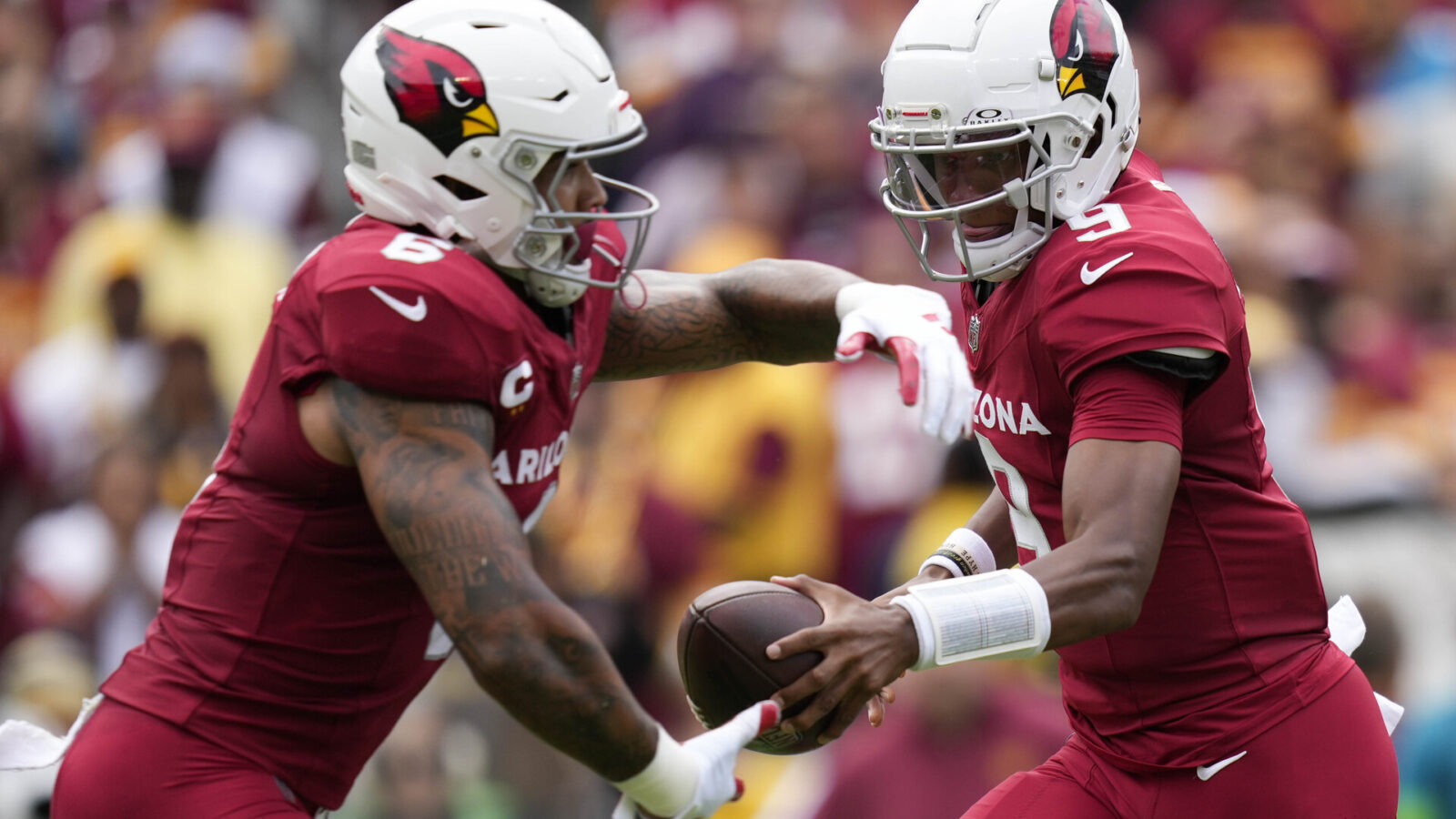 Sep 10, 2023; Landover, Maryland, USA; Arizona Cardinals quarterback Joshua Dobbs (9) hands the ball off to Arizona Cardinals running back James Conner (6) in the first half against the Washington Commanders at FedExField.