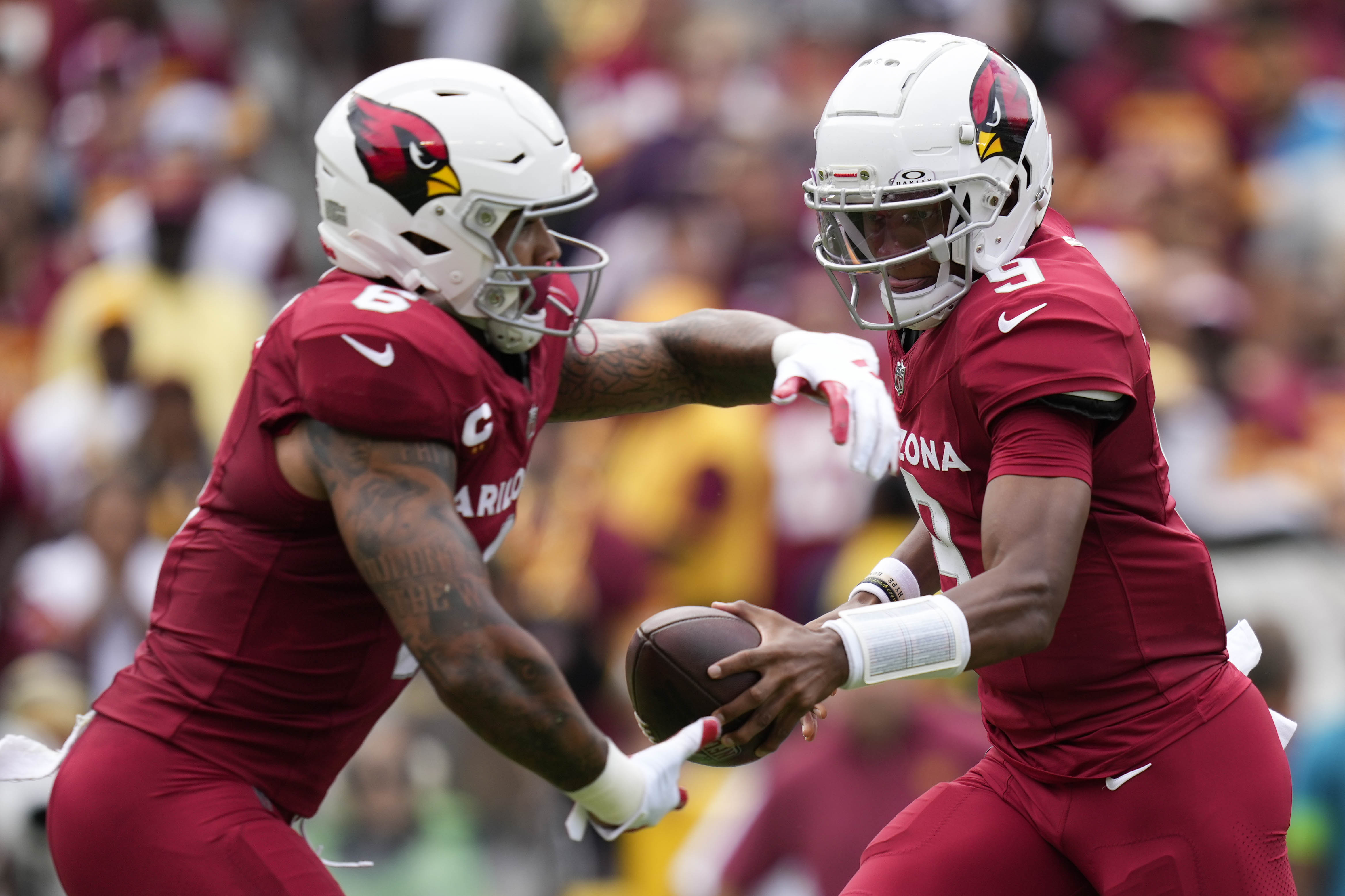 Sep 10, 2023; Landover, Maryland, USA; Arizona Cardinals quarterback Joshua Dobbs (9) hands the ball off to Arizona Cardinals running back James Conner (6) in the first half against the Washington Commanders at FedExField.