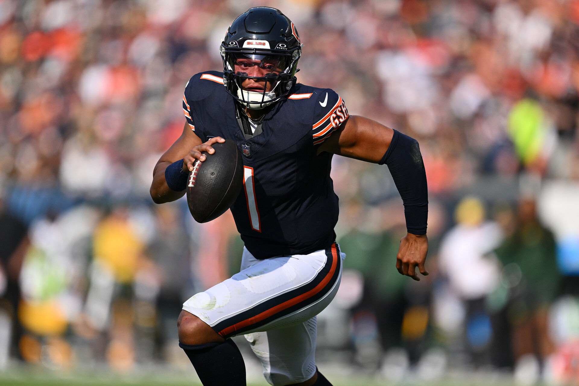 Sep 10, 2023; Chicago, Illinois, USA; Chicago Bears quarterback Justin Fields (1) runs the ball in the first half against the Green Bay Packers at Soldier Field.