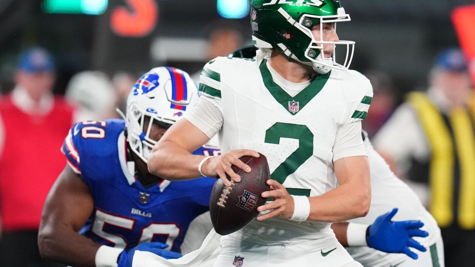 New York Jets quarterback Zach Wilson (2) looks to throw with pressure from Buffalo Bills defensive end Greg Rousseau (50) in the second half. The Jets defeat the Bills in overtime, 22-16, in the home opener at MetLife Stadium on Monday, Sept. 11, 2023, in East Rutherford.