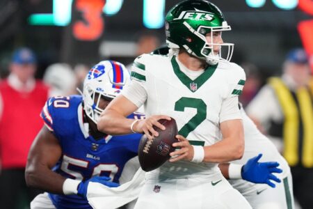 New York Jets quarterback Zach Wilson (2) looks to throw with pressure from Buffalo Bills defensive end Greg Rousseau (50) in the second half. The Jets defeat the Bills in overtime, 22-16, in the home opener at MetLife Stadium on Monday, Sept. 11, 2023, in East Rutherford.