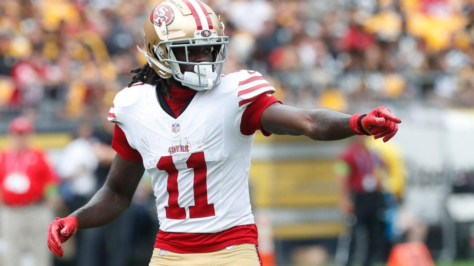 San Francisco 49ers wide receiver Brandon Aiyuk (11) gestures at the line of scrimmage against the Pittsburgh Steelers during the first quarter at Acrisure Stadium.