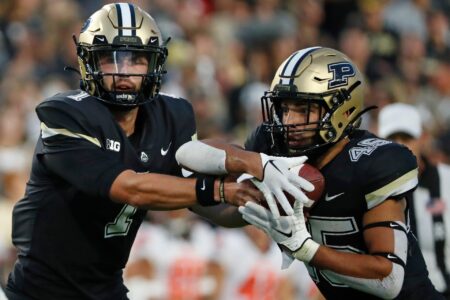 Purdue Boilermakers quarterback Hudson Card (1) hands the ball off to Purdue Boilermakers running back Devin Mockobee (45) during the NCAA football game against the Syracuse Orange, Wednesday, July 12, 2023, at Ross-Ade Stadium in West Lafayette, Ind.