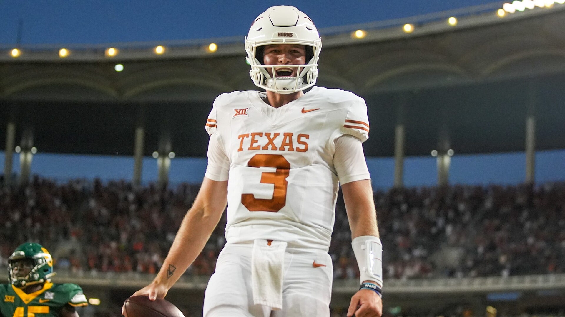 Texas quarterback Quinn Ewers (3) celebrates a touchdown against Baylor in the third quarter of an NCAA college football game, Saturday, Sept. 23, 2023, in Waco, Texas.