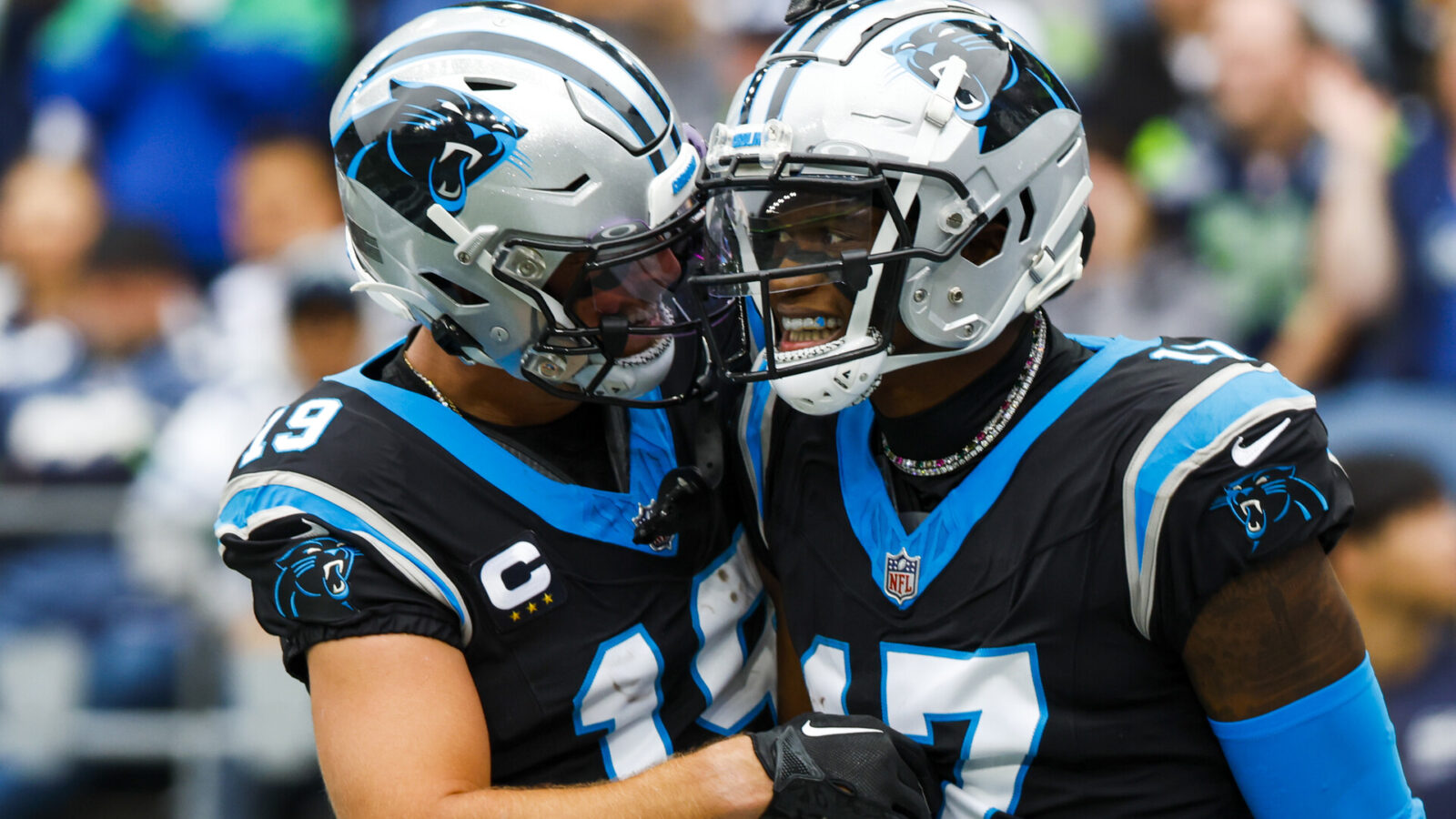 Carolina Panthers wide receiver DJ Chark Jr. (17) celebrates with wide receiver Adam Thielen (19) after catching a touchdown pass against the Seattle Seahawks during the second quarter at Lumen Field.