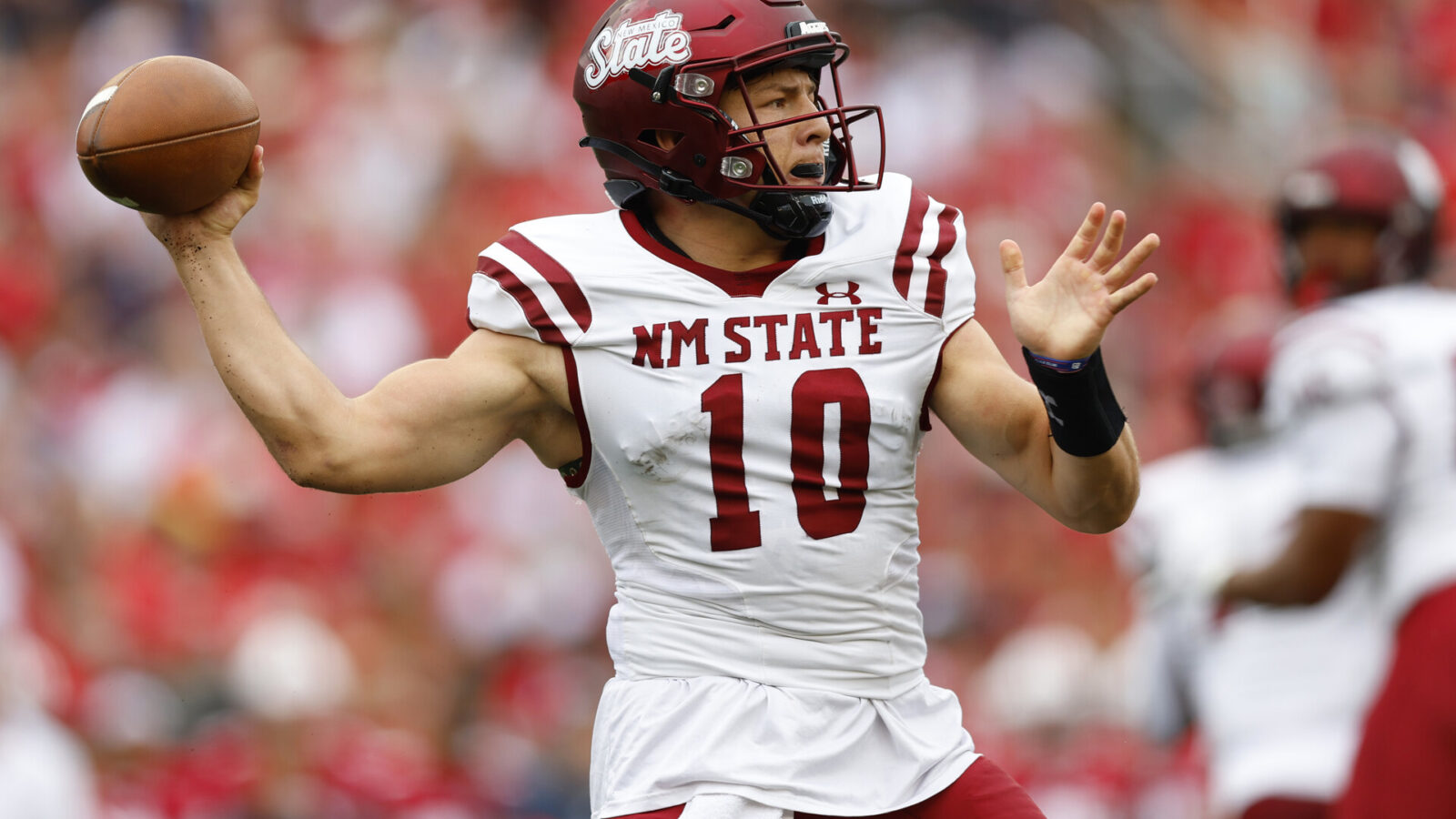 New Mexico State Aggies quarterback Diego Pavia (10) throws a pass during the first quarter against the Wisconsin Badgers at Camp Randall Stadium.