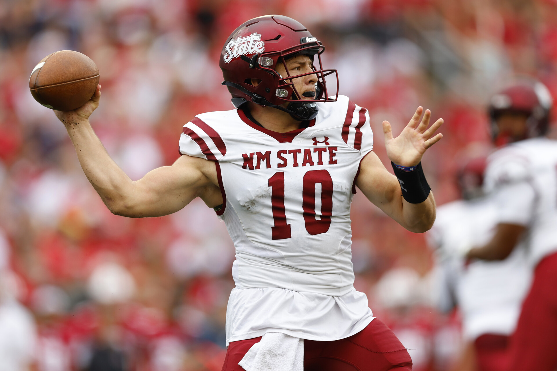 New Mexico State Aggies quarterback Diego Pavia (10) throws a pass during the first quarter against the Wisconsin Badgers at Camp Randall Stadium.