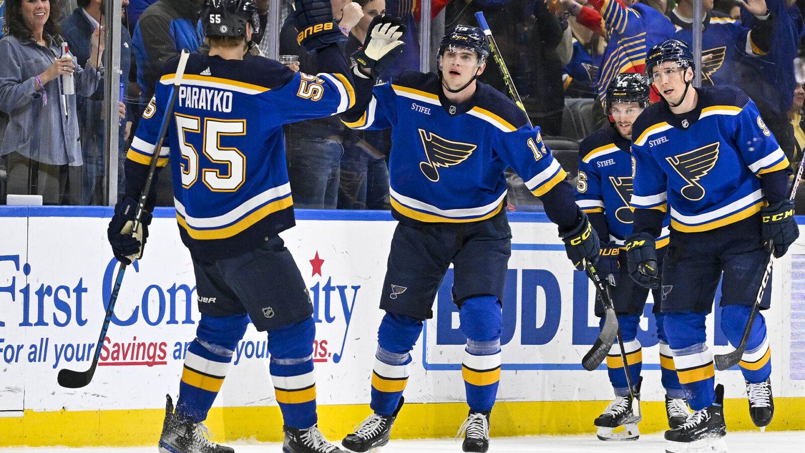 Mar 28, 2023; St. Louis, Missouri, USA; St. Louis Blues right wing Alexey Toropchenko (13) is congratulated by defenseman Colton Parayko (55) after scoring against the Vancouver Canucks during the first period at Enterprise Center.
