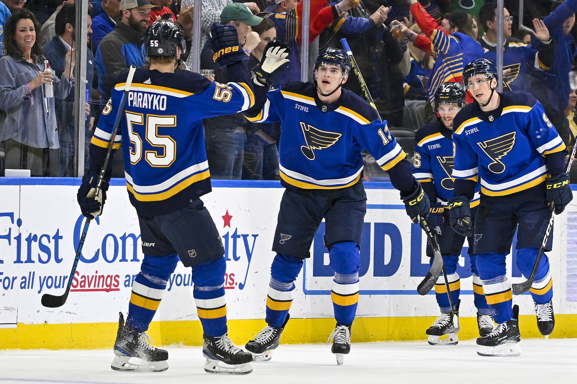 Mar 28, 2023; St. Louis, Missouri, USA; St. Louis Blues right wing Alexey Toropchenko (13) is congratulated by defenseman Colton Parayko (55) after scoring against the Vancouver Canucks during the first period at Enterprise Center.