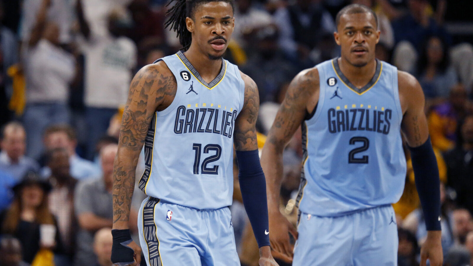 Apr 26, 2023; Memphis, Tennessee, USA; Memphis Grizzlies guard Ja Morant (12) and forward Xavier Tillman (2) get back on defense during the second half against the Los Angeles Lakers during game five of the 2023 NBA playoffs at FedExForum.