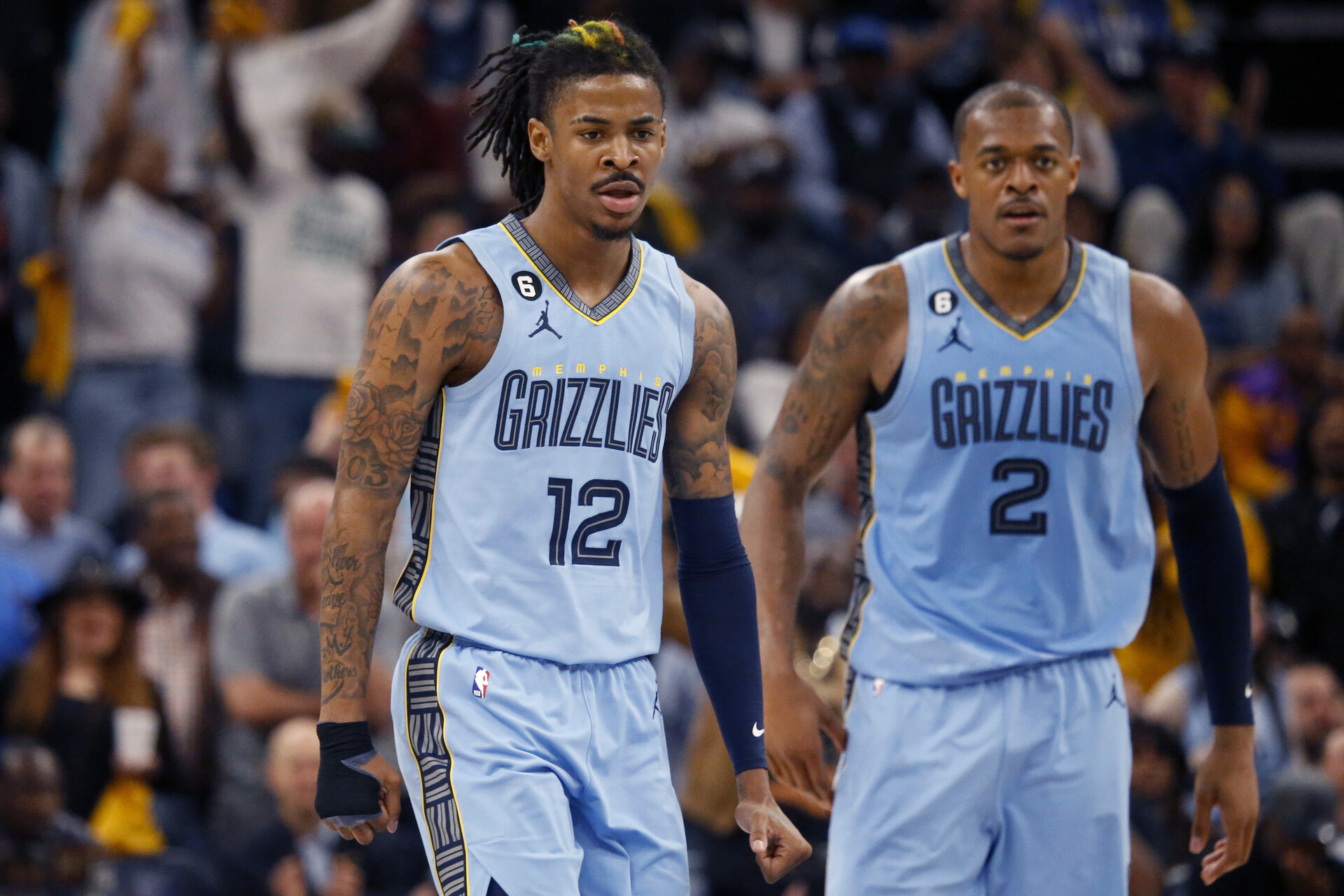 Apr 26, 2023; Memphis, Tennessee, USA; Memphis Grizzlies guard Ja Morant (12) and forward Xavier Tillman (2) get back on defense during the second half against the Los Angeles Lakers during game five of the 2023 NBA playoffs at FedExForum.