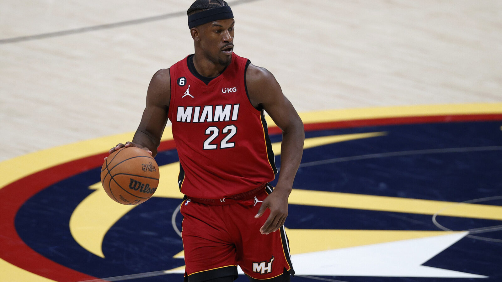 Jun 1, 2023; Denver, CO, USA; Miami Heat forward Jimmy Butler (22) dribbles the ball during the second half in game one of the 2023 NBA Finals against the Denver Nuggets at Ball Arena.