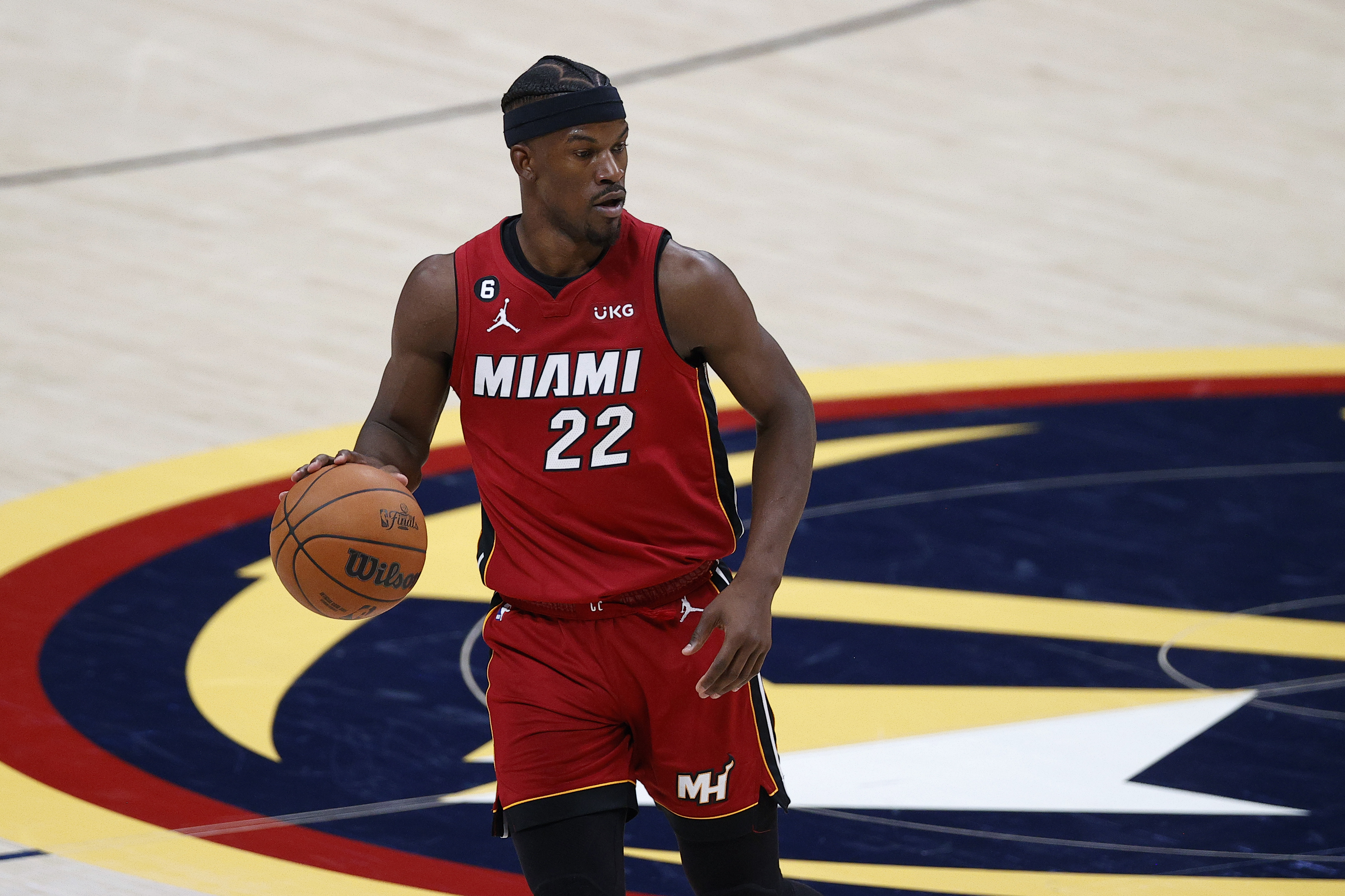 Jun 1, 2023; Denver, CO, USA; Miami Heat forward Jimmy Butler (22) dribbles the ball during the second half in game one of the 2023 NBA Finals against the Denver Nuggets at Ball Arena.