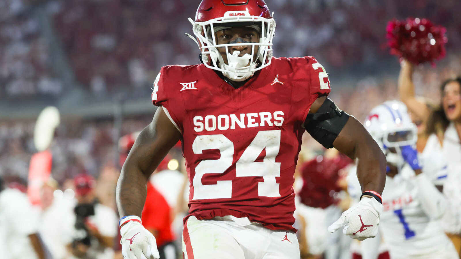 Oklahoma Sooners running back Marcus Major (24) reacts after scoring a touchdown during the fourth quarter against the Southern Methodist Mustangs at Gaylord Family-Oklahoma Memorial Stadium.