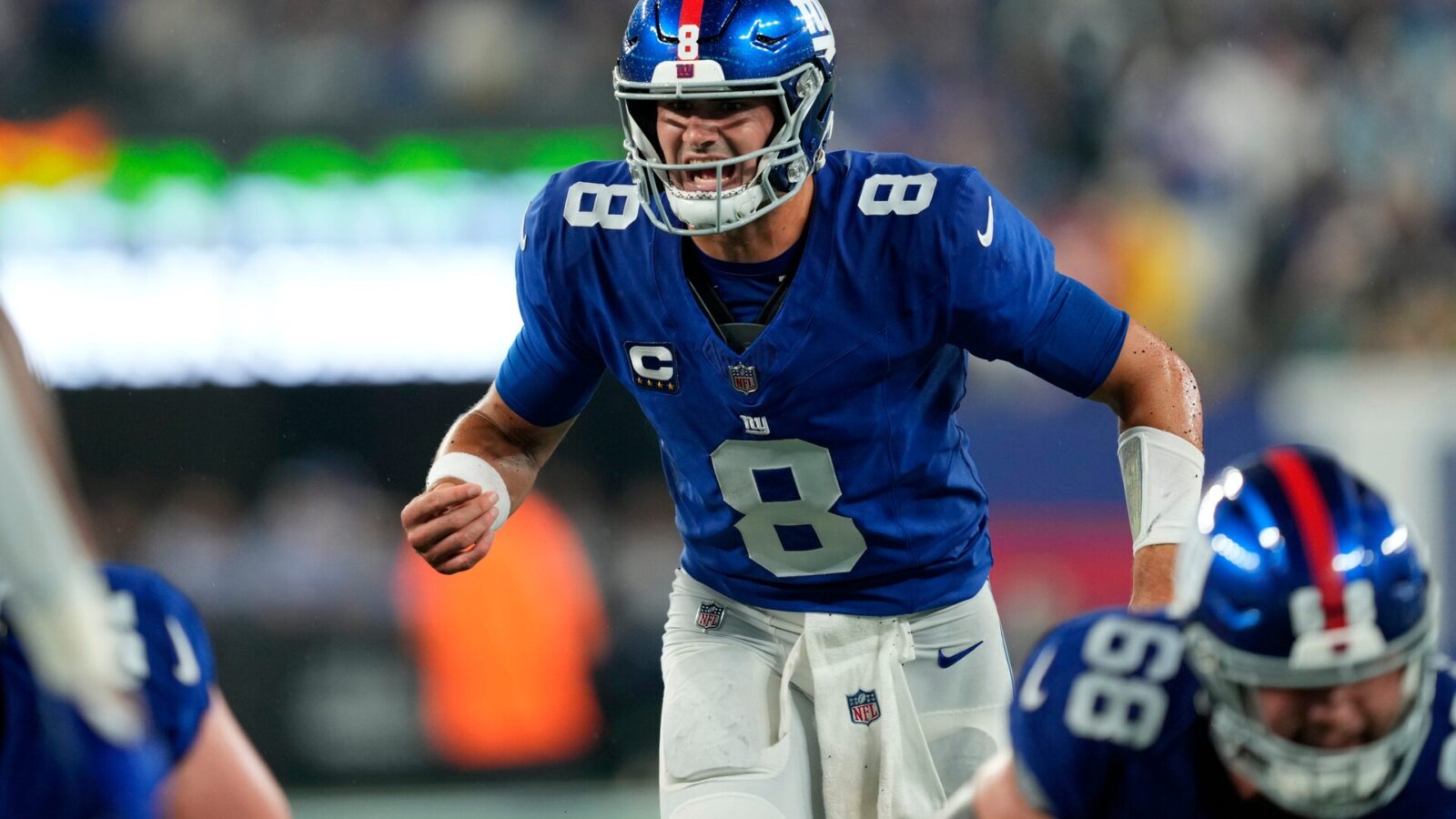 New York Giants quarterback Daniel Jones (8) had a difficult time handling the wet ball and the Dallas Cowboys.