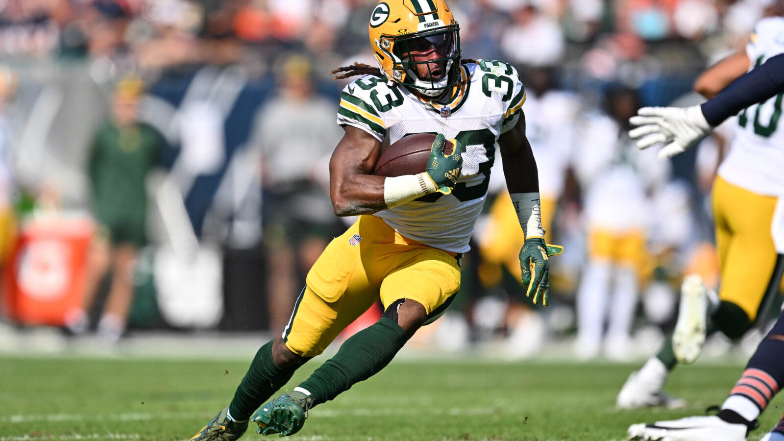 Sep 10, 2023; Chicago, Illinois, USA; Green Bay Packers running back Aaron Jones (33) runs with the ball against the Chicago Bears at Soldier Field.