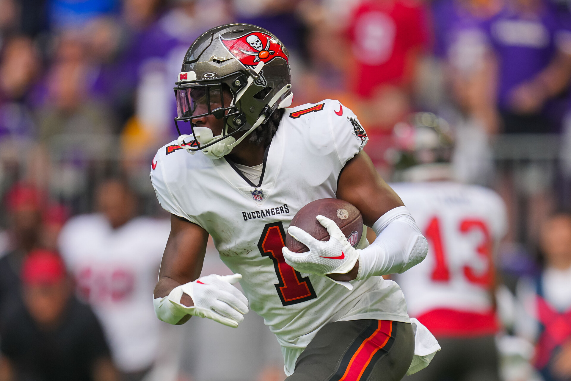 Tampa Bay Buccaneers running back Rachaad White (1) runs with the ball against the Minnesota Vikings in the second quarter at U.S. Bank Stadium.