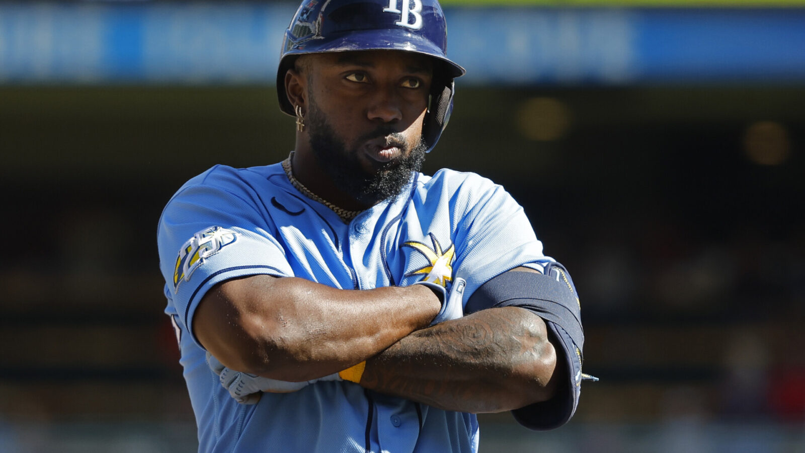 Tampa Bay Rays left fielder Randy Arozarena (56) stops at third base to celebrate his solo home run against the Minnesota Twins in the ninth inning at Target Field.
