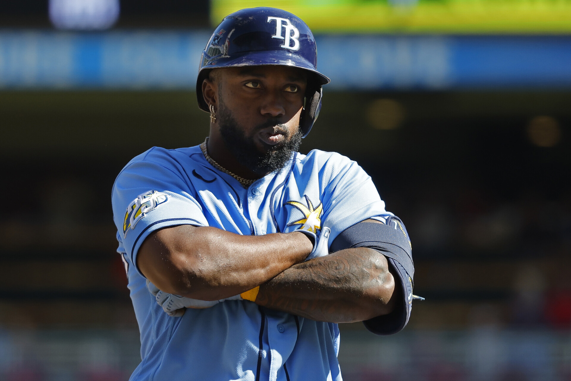 Tampa Bay Rays left fielder Randy Arozarena (56) stops at third base to celebrate his solo home run against the Minnesota Twins in the ninth inning at Target Field.