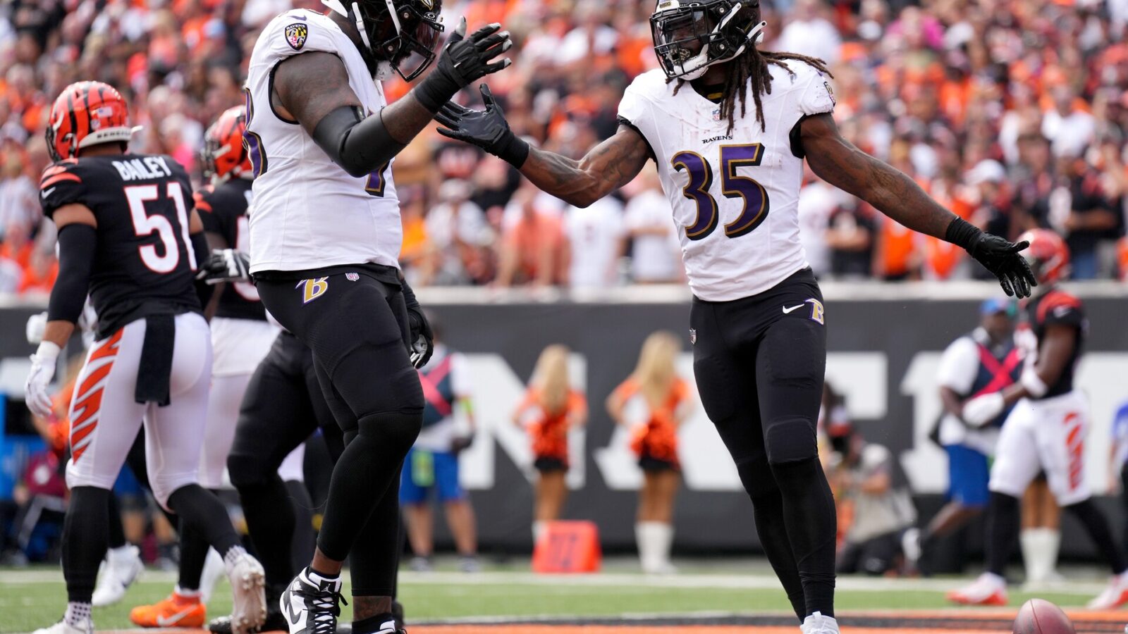 Baltimore Ravens running back Gus Edwards (35) celebrates a touchdown with Baltimore Ravens offensive tackle Morgan Moses (78) in the first quarter of a Week 2 NFL football game between the Baltimore Ravens and the Cincinnati Bengals Sunday, Sept. 17, 2023, at Paycor Stadium in Cincinnati.