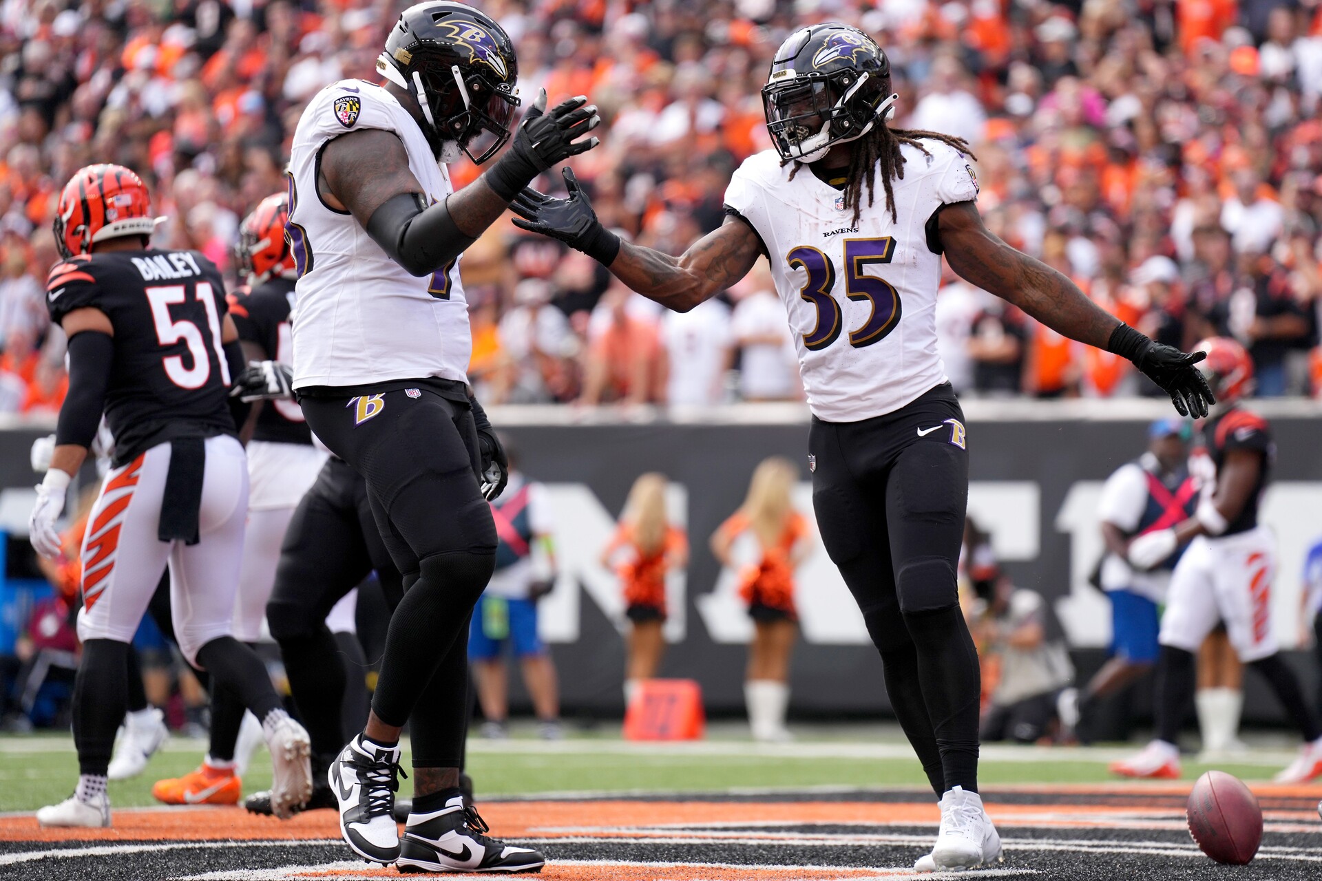 Baltimore Ravens running back Gus Edwards (35) celebrates a touchdown with Baltimore Ravens offensive tackle Morgan Moses (78) in the first quarter of a Week 2 NFL football game between the Baltimore Ravens and the Cincinnati Bengals Sunday, Sept. 17, 2023, at Paycor Stadium in Cincinnati.