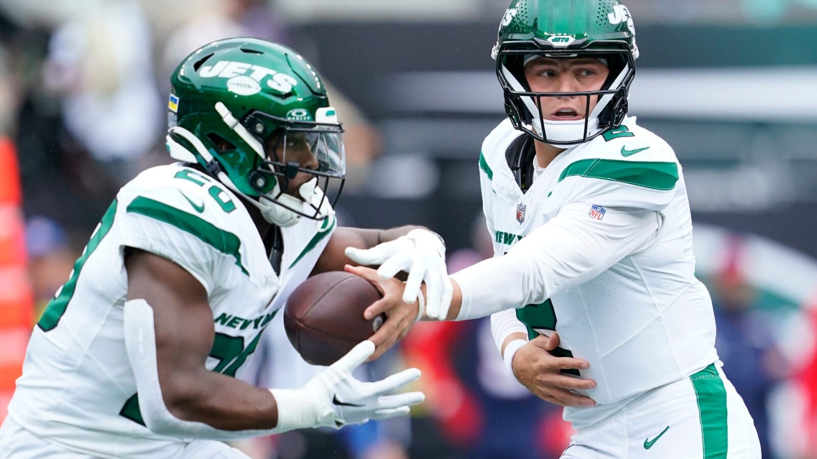 New York Jets quarterback Zach Wilson (2) hands the ball to running back Breece Hall (20) in the first half against the New England Patriots at MetLife Stadium on Sunday, Sept. 24, 2023, in East Rutherford.
