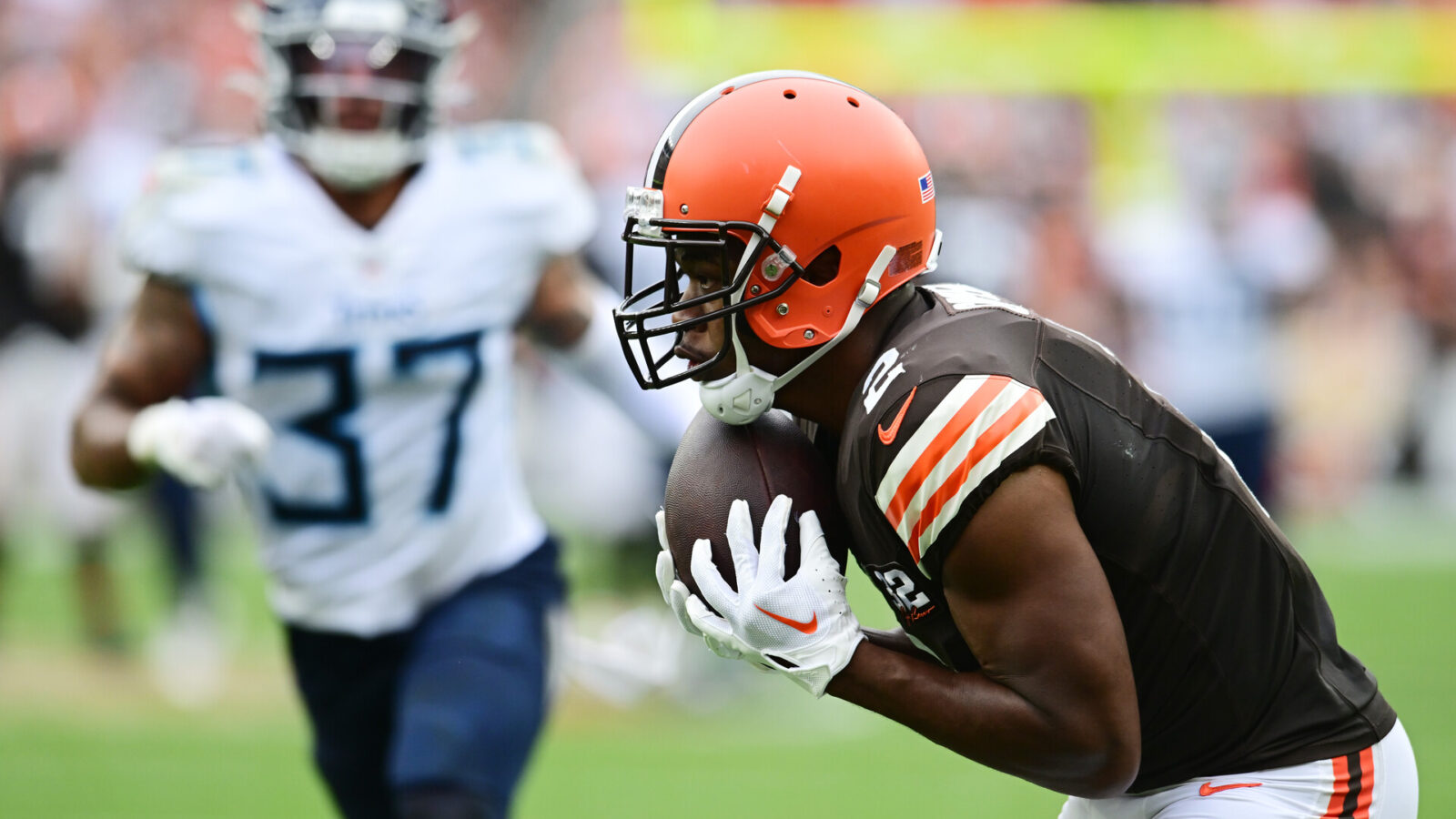 Sep 24, 2023; Cleveland, Ohio, USA; Cleveland Browns wide receiver Amari Cooper (2) catches a touchdown as Tennessee Titans safety Amani Hooker (37) defends during the second half at Cleveland Browns Stadium.