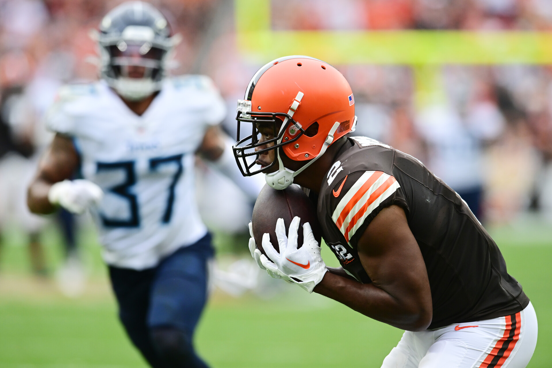 Sep 24, 2023; Cleveland, Ohio, USA; Cleveland Browns wide receiver Amari Cooper (2) catches a touchdown as Tennessee Titans safety Amani Hooker (37) defends during the second half at Cleveland Browns Stadium.