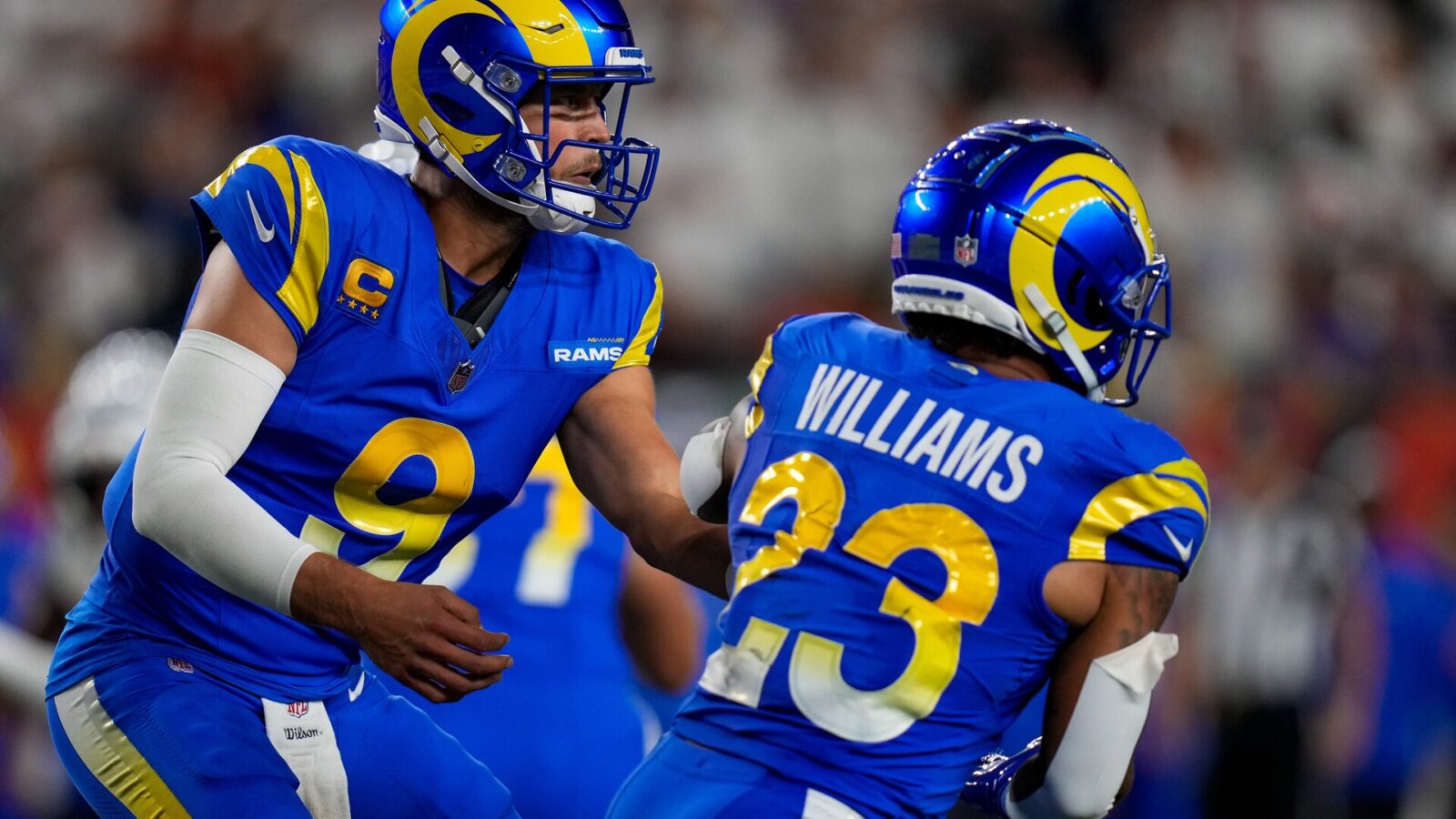 Los Angeles Rams quarterback Matthew Stafford (9) hands off to running back Kyren Williams (23) in the second quarter of the NFL Week 3 game between the Cincinnati Bengals and the Los Angeles Rams at Paycor Stadium in downtown Cincinnati on Monday, Sept. 25, 2023. The game was tied 6-6 at halftime.