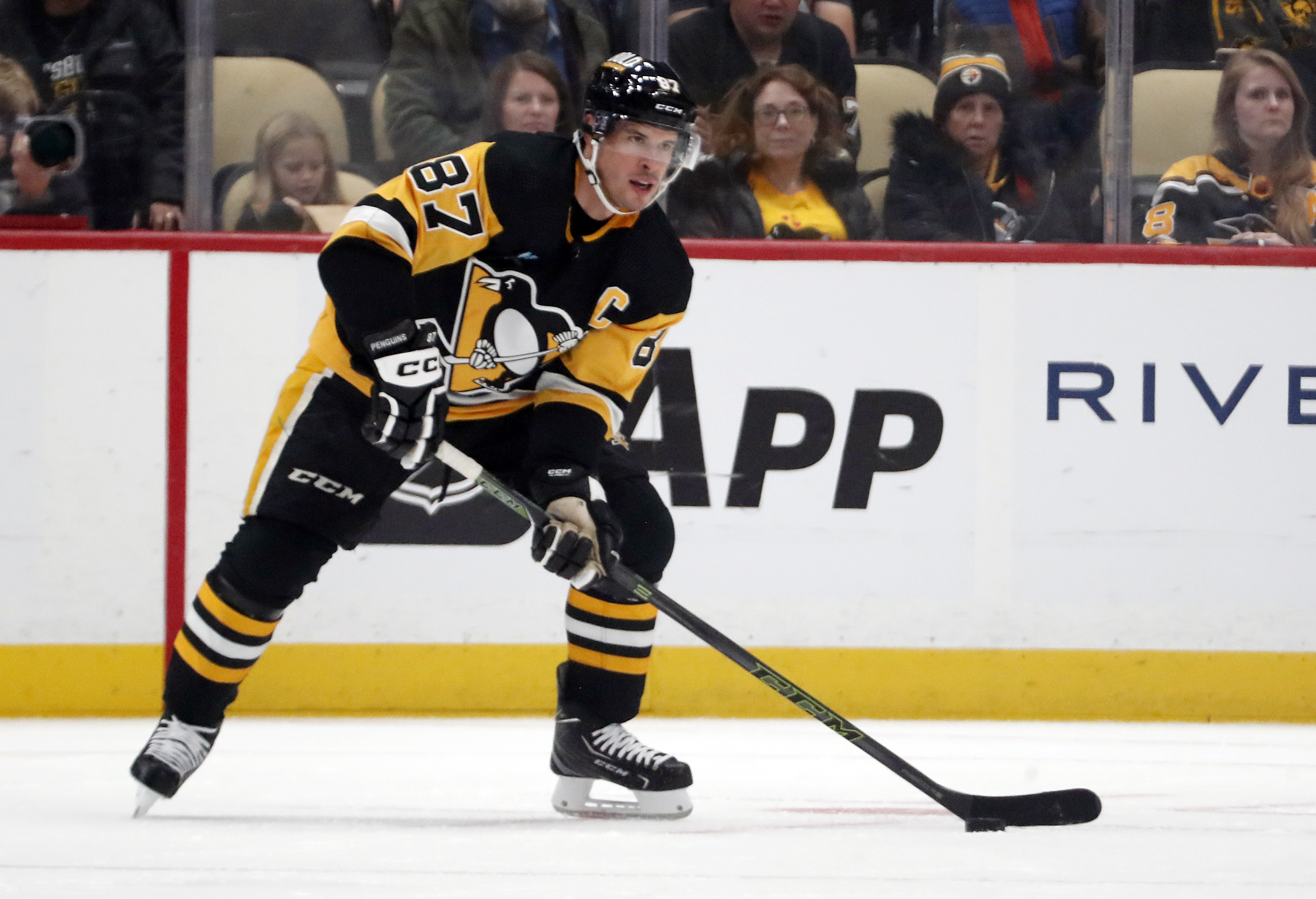 Sep 28, 2023; Pittsburgh, Pennsylvania, USA; Pittsburgh Penguins center Sidney Crosby (87) handles the puck against the Buffalo Sabres during the first period at PPG Paints Arena.