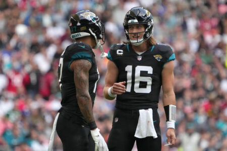 Oct 1, 2023; London, United Kingdom; Jacksonville Jaguars quarterback Trevor Lawrence (16) talks with tight end Evan Engram (17) against the Atlanta Falcons in the first half during an NFL International Series game at Wembley Stadium.