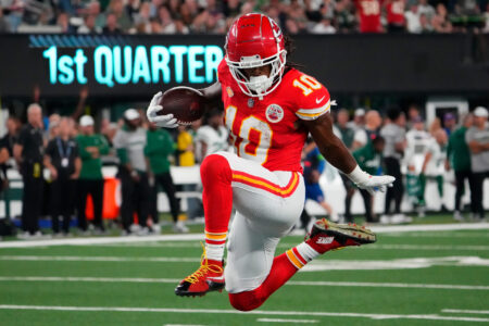 Oct 1, 2023; East Rutherford, New Jersey, USA; Kansas City Chiefs running back Isiah Pacheco (10) on his way to scoring a 1st half touchdown against te Jets at MetLife Stadium.