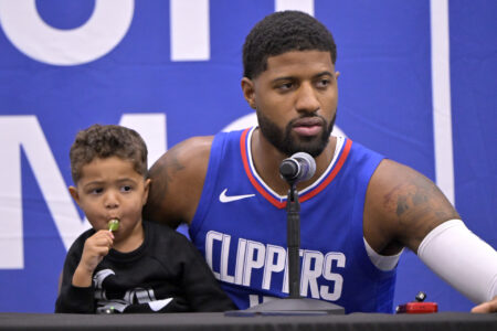 Oct 2, 2023; Los Angeles, CA, USA; Los Angeles Clippers forward Paul George (13) with his two year old son Paul Vuk George, during a new conference on media day at the Honey Training Center in Playa Vista, CA