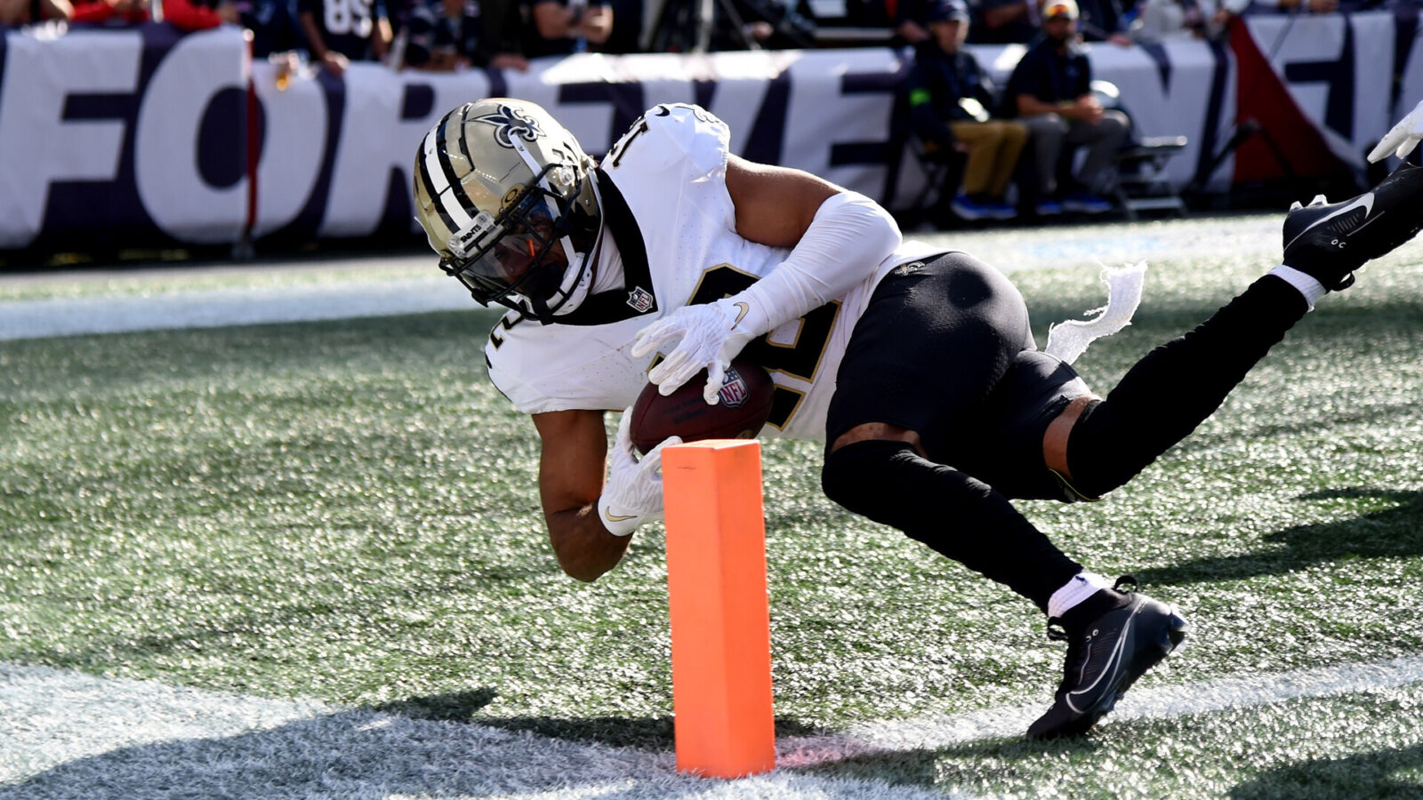 Oct 8, 2023; Foxborough, Massachusetts, USA; New Orleans Saints wide receiver Chris Olave (12) can’t control the ball as he crosses the end zone during the second half against the New England Patriots at Gillette Stadium.